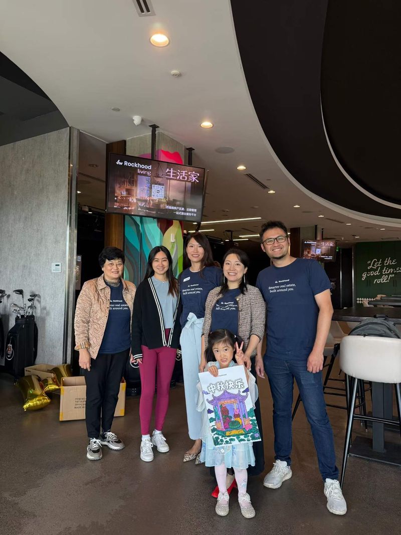 Group photo with clients and friends at the mini golf lounge