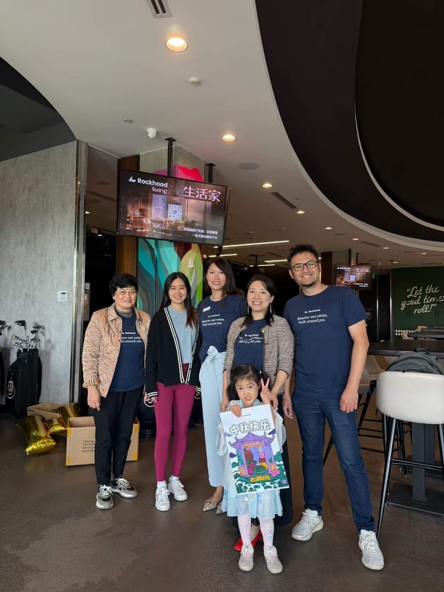 Group photo with clients and friends at the mini golf lounge